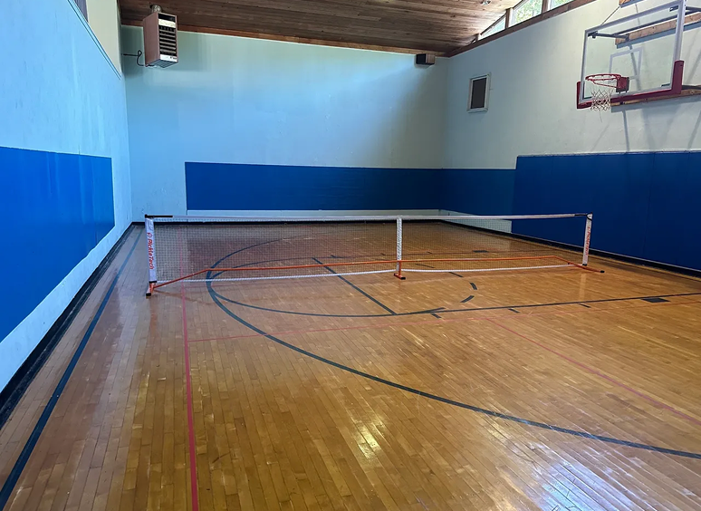 Indoor pickleball court with net