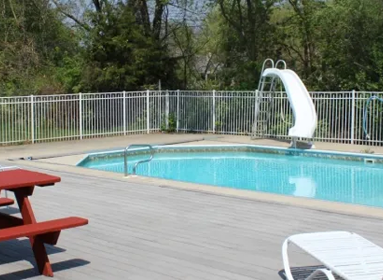 Outdoor pool with slide and deck