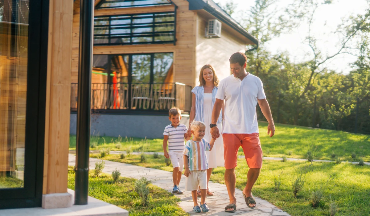 Happy family strolling in backyard