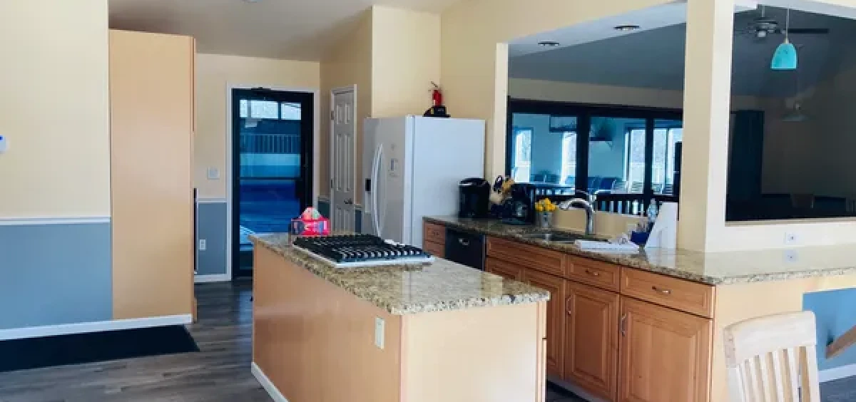 Modern kitchen with island and granite countertops